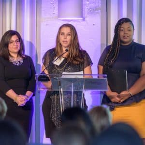 Raphael House of Portland annual gala 3 women speaking from stage